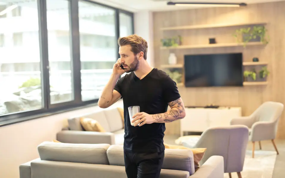 Man using his phone at home